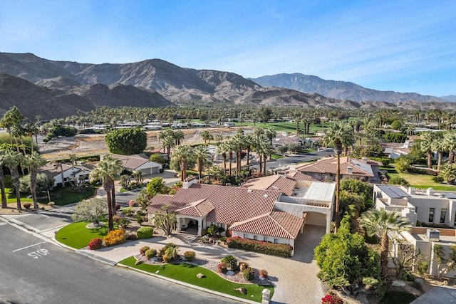 birds eye view of property featuring a mountain view