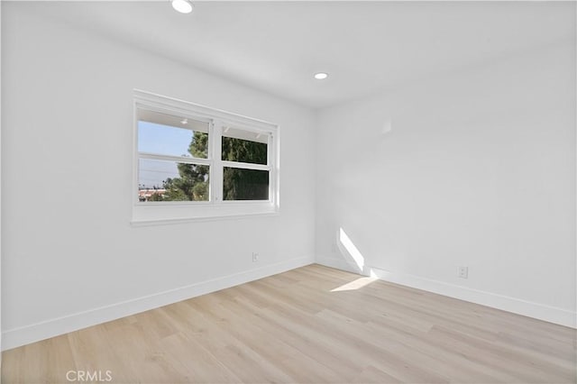 unfurnished room featuring light hardwood / wood-style floors