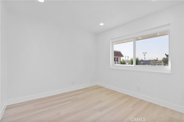 spare room with light hardwood / wood-style floors