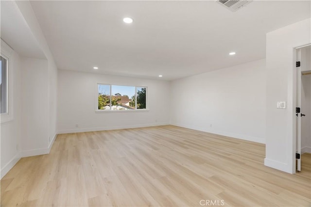 unfurnished room featuring light hardwood / wood-style floors