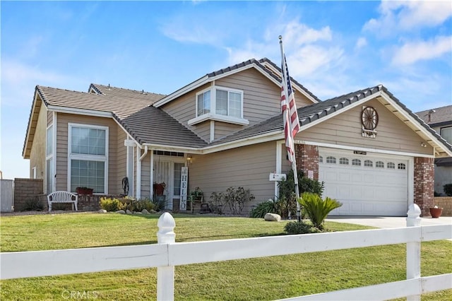 view of front of property with a garage and a front yard