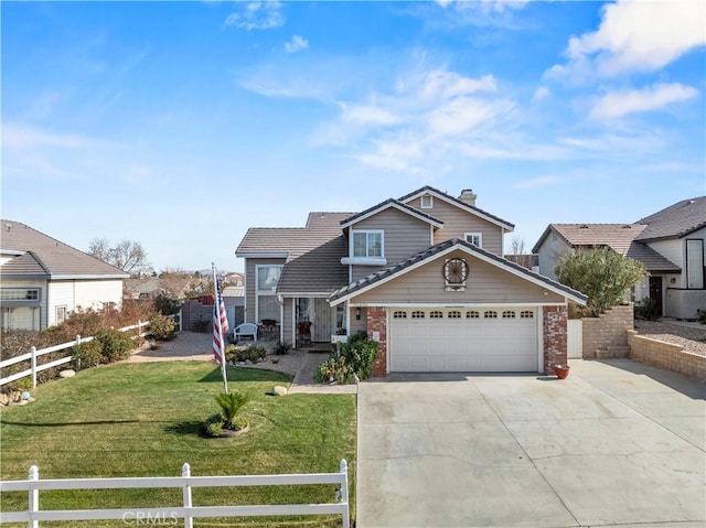 view of front of property featuring a garage and a front lawn