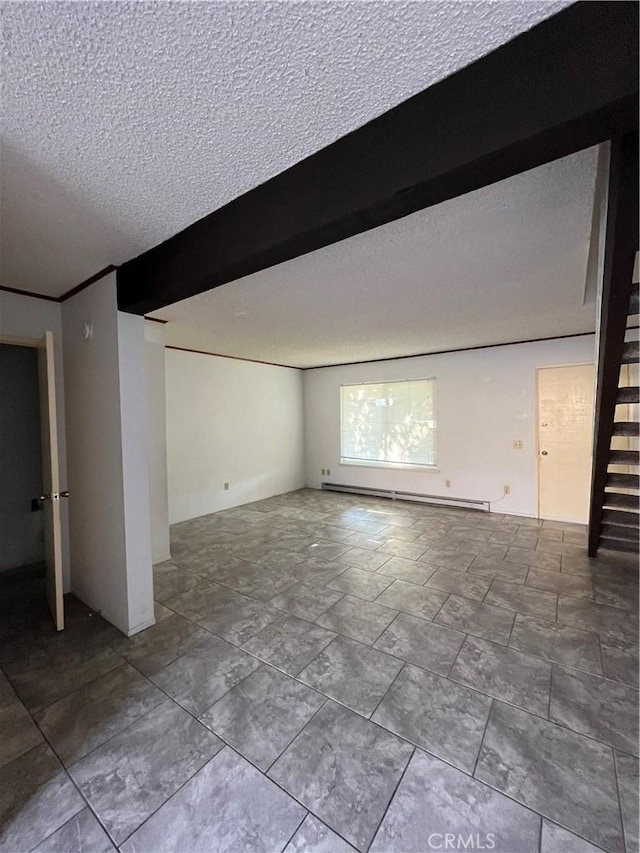 interior space with a textured ceiling and baseboard heating