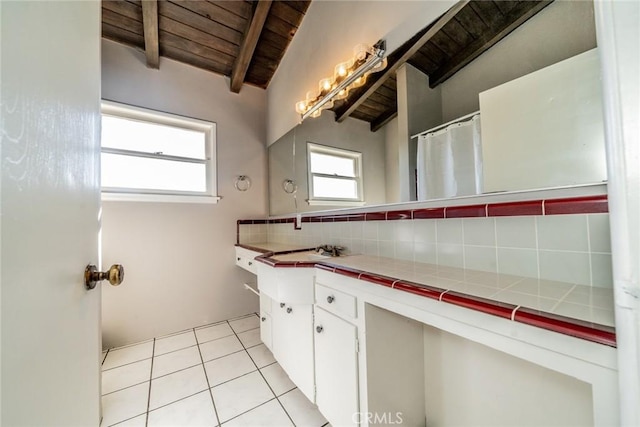 bathroom with wood ceiling, decorative backsplash, tile patterned floors, vanity, and lofted ceiling with beams