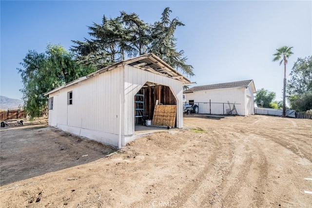 view of home's exterior featuring an outdoor structure