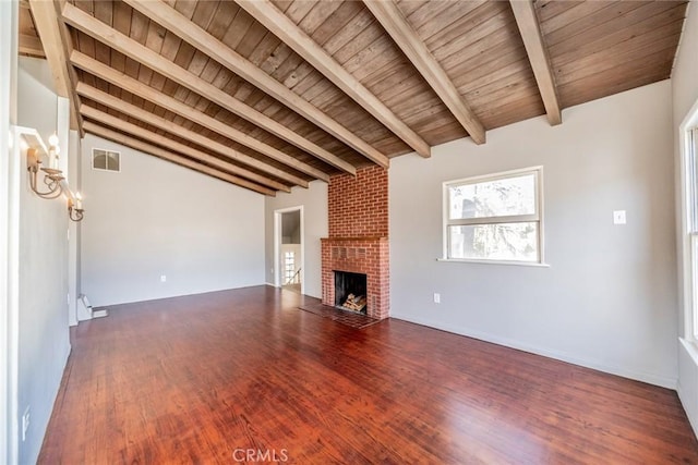 unfurnished living room with vaulted ceiling with beams, wood-type flooring, a fireplace, and wooden ceiling