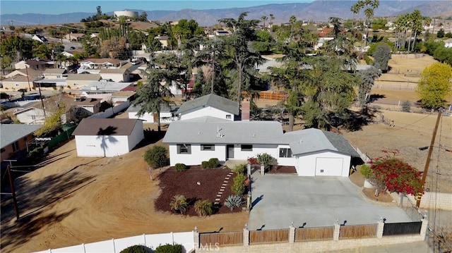 birds eye view of property featuring a mountain view