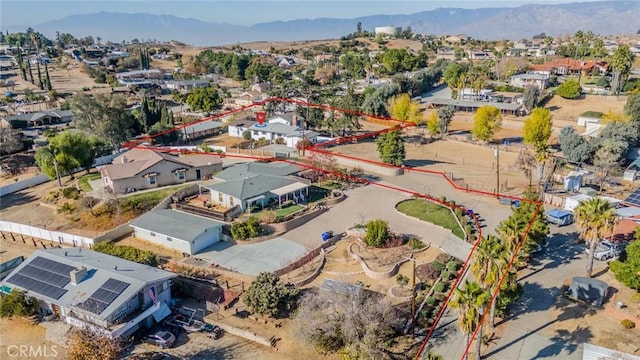 birds eye view of property featuring a mountain view