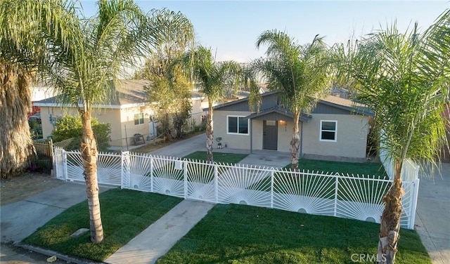 view of front of property with a front lawn