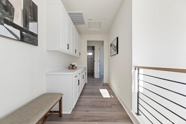 corridor featuring dark hardwood / wood-style flooring