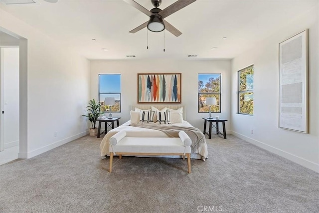 bedroom with ceiling fan and carpet flooring