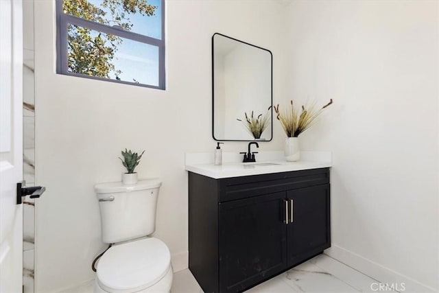 bathroom featuring toilet and vanity