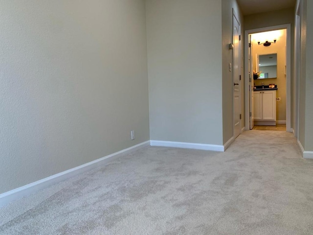 spare room with light colored carpet