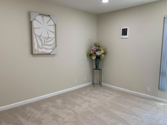 empty room featuring light colored carpet