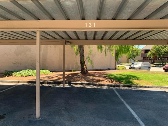 view of vehicle parking with a carport