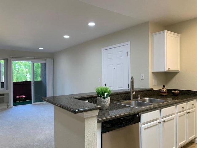 kitchen featuring white cabinetry, stainless steel dishwasher, kitchen peninsula, and sink