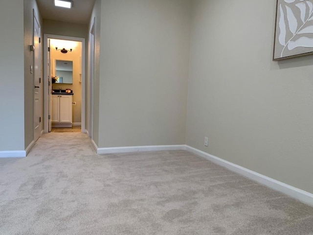 empty room featuring light colored carpet