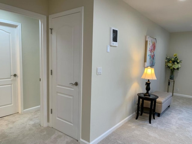 hallway with light carpet