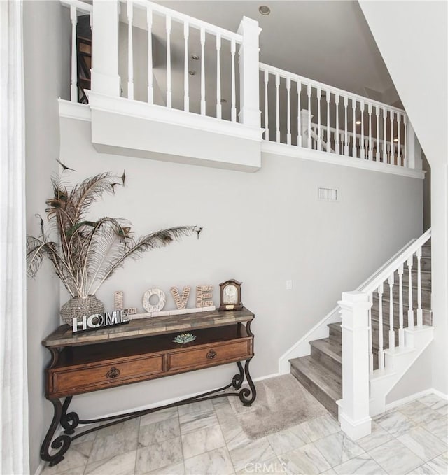 stairway with a high ceiling