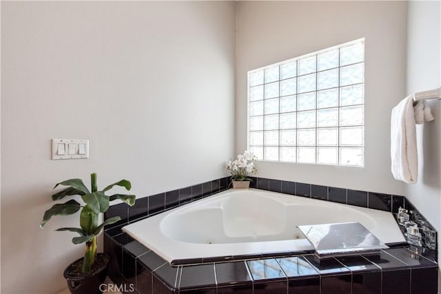 bathroom with tiled tub