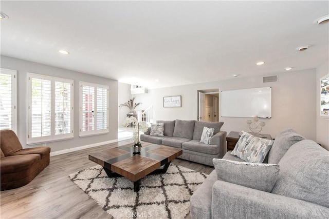 living room with light hardwood / wood-style flooring