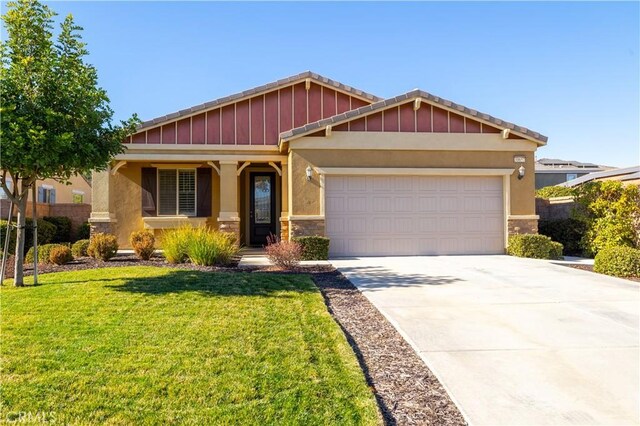 craftsman-style house with a front lawn and a garage