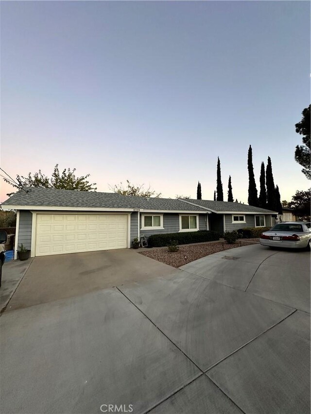 ranch-style home with a garage