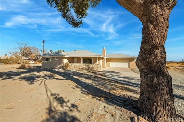 ranch-style house featuring a garage