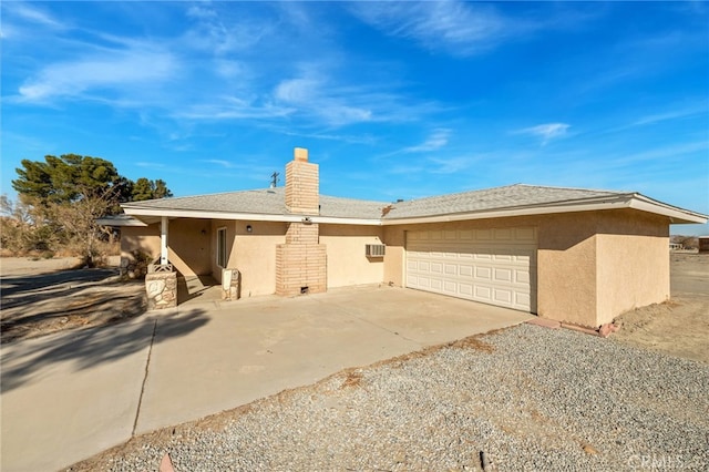 single story home featuring a garage