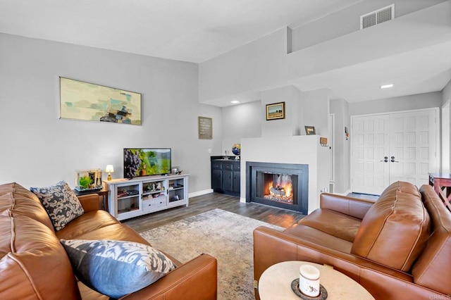 living room featuring dark hardwood / wood-style flooring