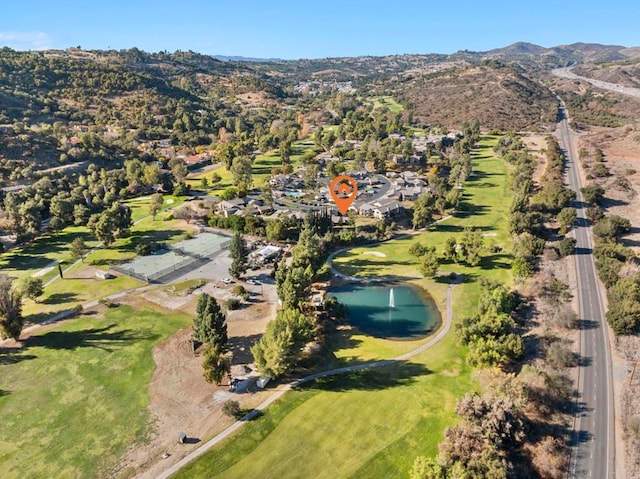 aerial view featuring a water and mountain view