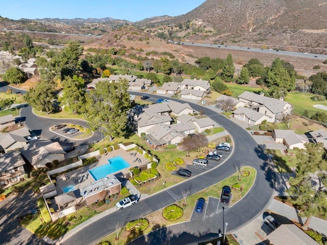 birds eye view of property with a mountain view