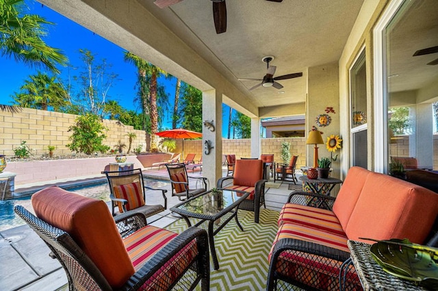 view of patio featuring ceiling fan, an outdoor living space, and pool water feature