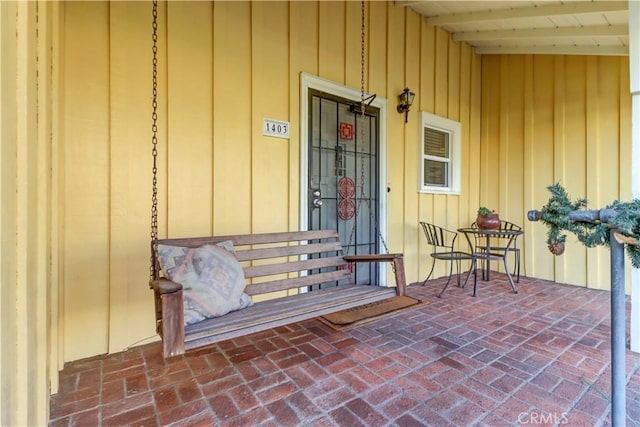 doorway to property with covered porch