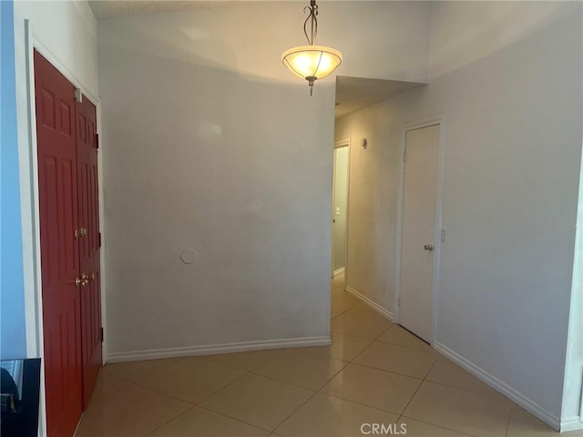 hallway featuring light tile patterned floors