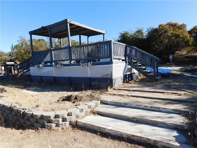 exterior space featuring a wooden deck