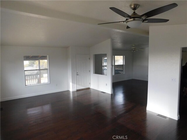 unfurnished living room with ceiling fan, dark hardwood / wood-style flooring, and lofted ceiling