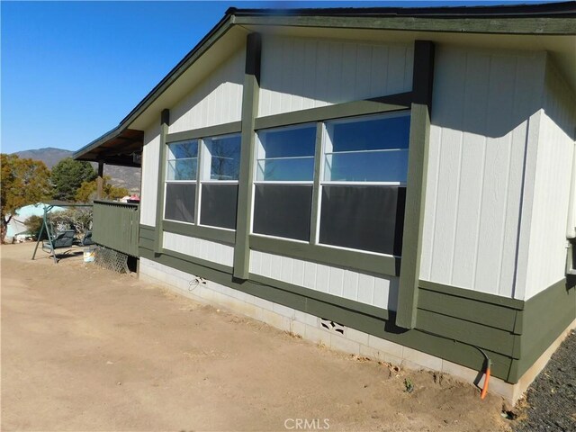 view of property exterior featuring a mountain view