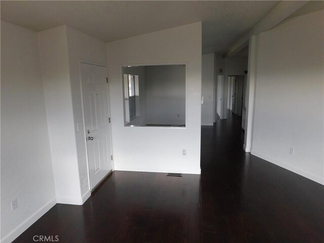 empty room featuring dark hardwood / wood-style floors