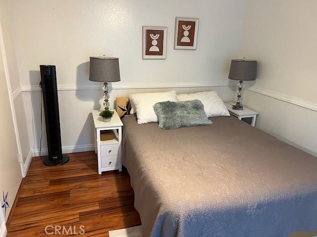 bedroom featuring dark hardwood / wood-style floors