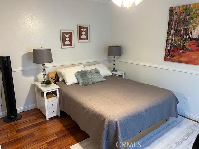 bedroom featuring dark wood-type flooring