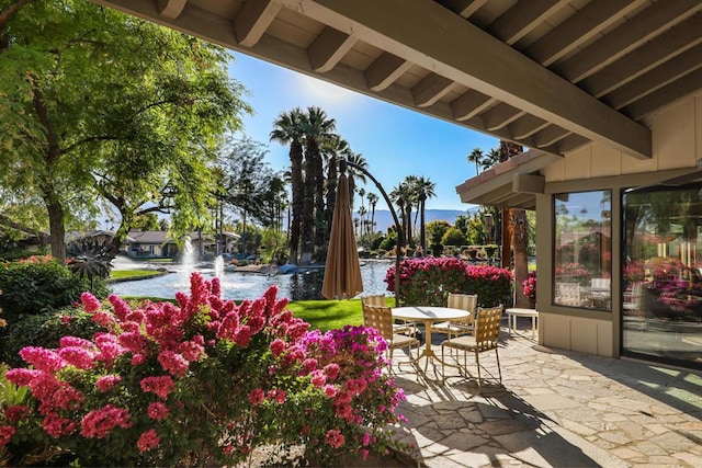 view of patio featuring a water view