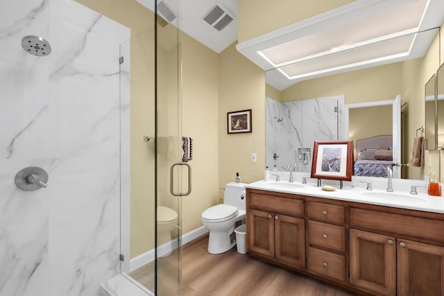 bathroom with toilet, a shower with shower door, hardwood / wood-style floors, lofted ceiling, and vanity