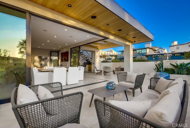 patio terrace at dusk with outdoor lounge area