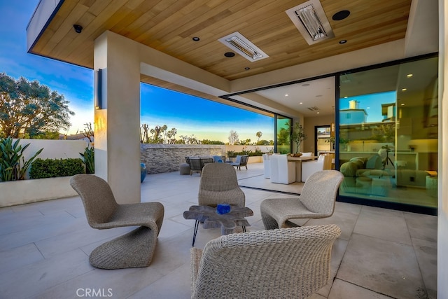 patio terrace at dusk with outdoor lounge area