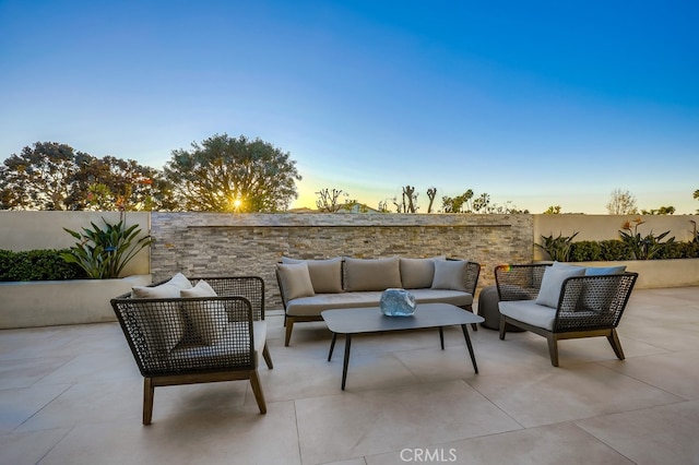 patio terrace at dusk with outdoor lounge area