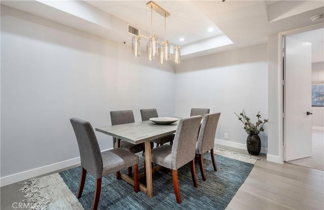 dining area with recessed lighting, wood finished floors, visible vents, and baseboards