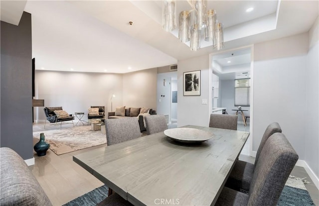 dining room featuring baseboards, an inviting chandelier, visible vents, and recessed lighting