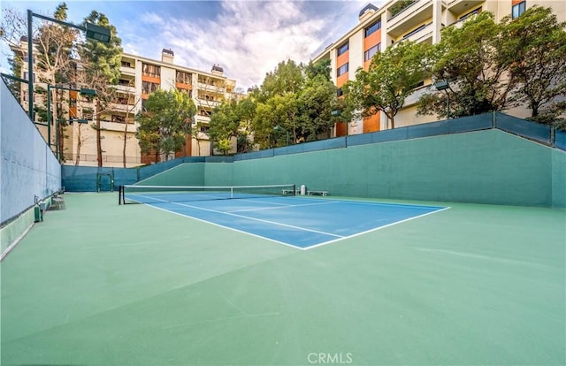 view of sport court with fence