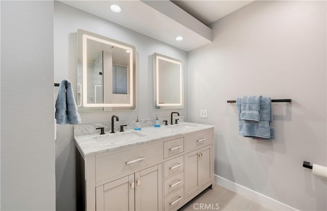 bathroom featuring tile patterned flooring and vanity